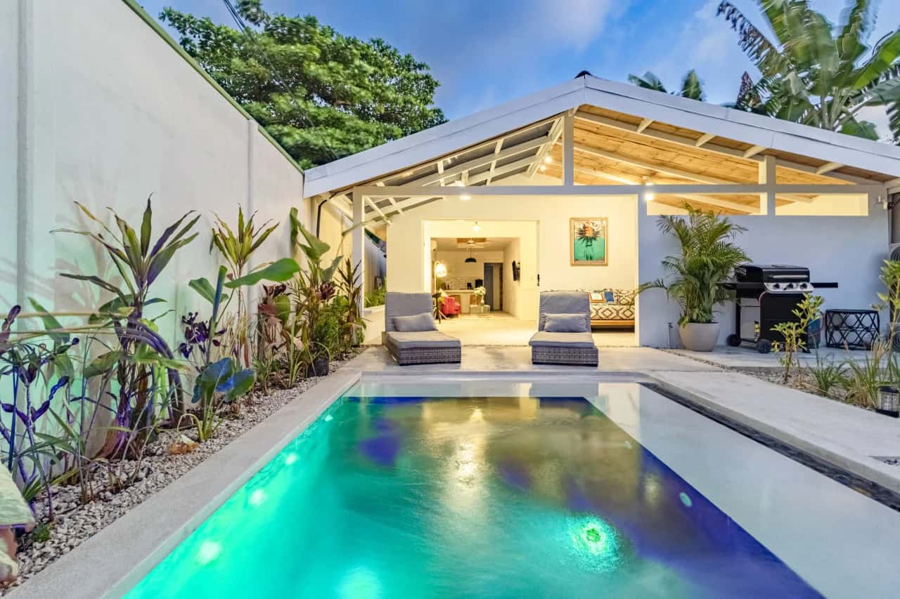 Casa Bonimus and its illuminated private pool at dusk
