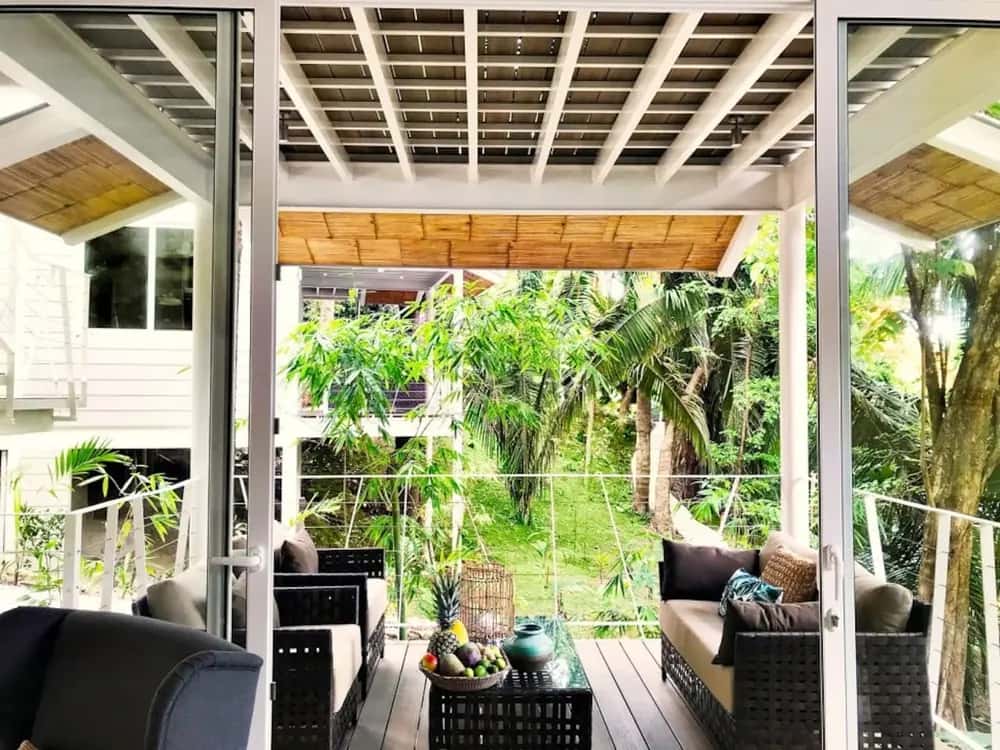 Covered terrace overlooking tropical plants — marAmar Luxury Apartment V