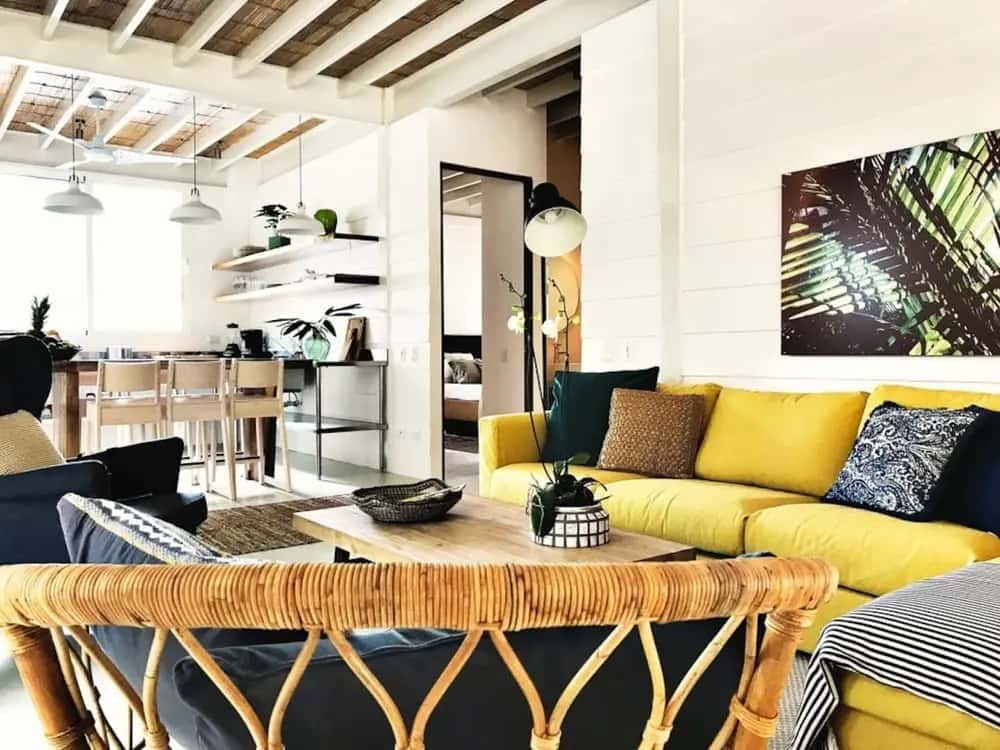 Dining table beside a bright open-plan living room — marAmar Luxury Apartment VI