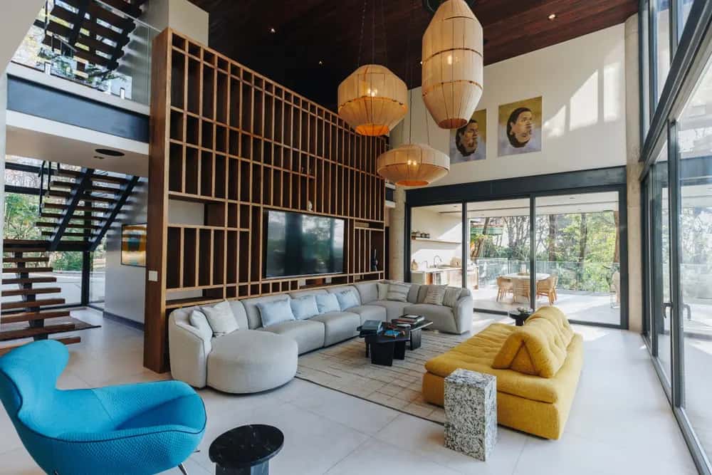 Double-height lounge with colourful seating — Casa Xelva